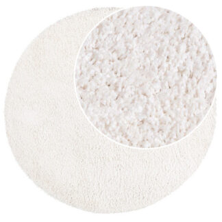 Rund offwhite ryamatta i polypropylen med cirka 30 mm tjocklek på golv