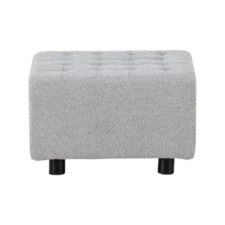 Ljusgrå sittpuff i bouclétyg med svarta metallben i modern inredning