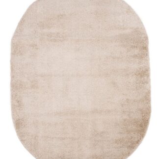 Oval beige ryamatta i polypropylen med cirka 24 mm tjocklek på golv