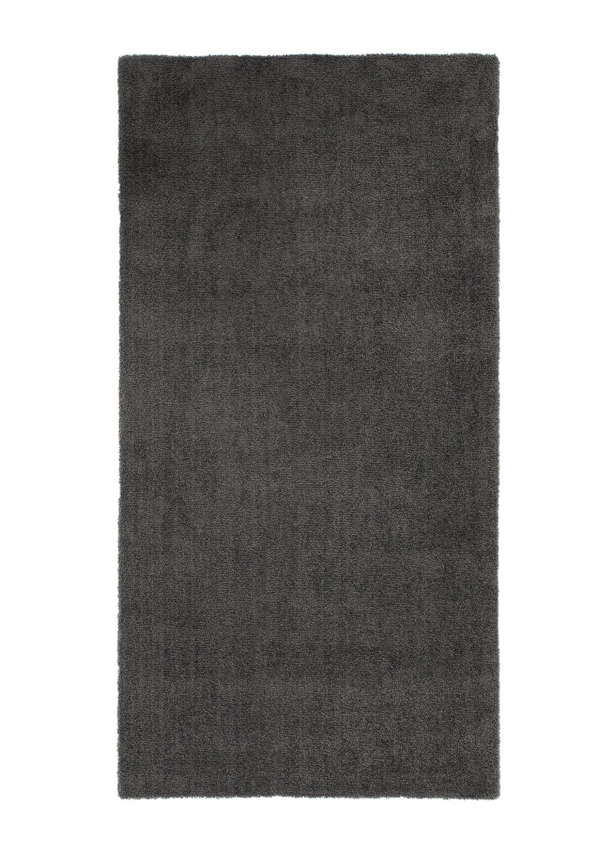 Mjuk grafitgrå ryamatta med filtskydd och tjock struktur i ett modernt hem