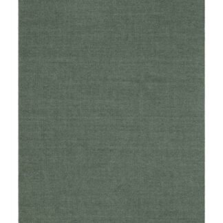 Grön handvävd ullmatta Rachel med dekorativ kant i hemmiljö