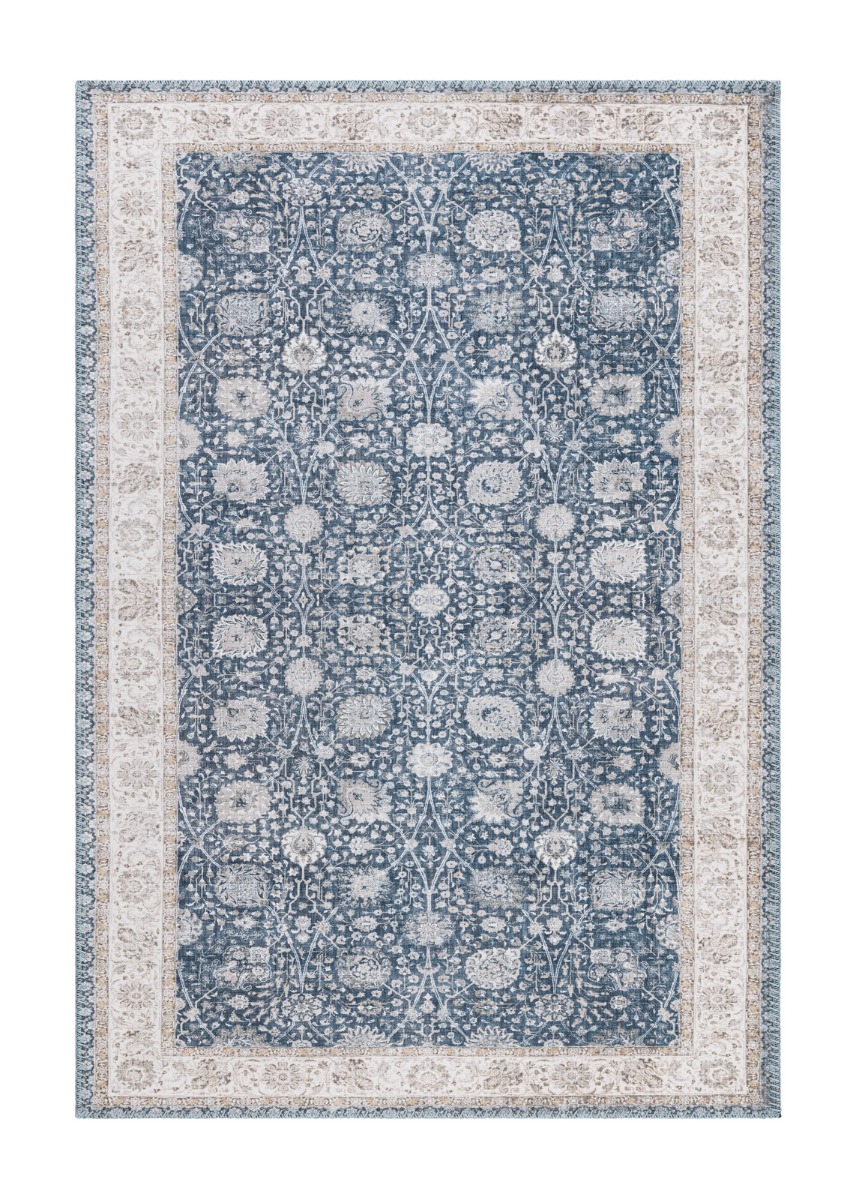 Tvättbar blå Velmorra-matta med mjuk yta och halkfri undersida i ett modernt vardagsrum