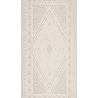 Krämfärgad Yoko gångmatta med varierande textur och tuftade partier i linnefärgad ton placerad på trägolv