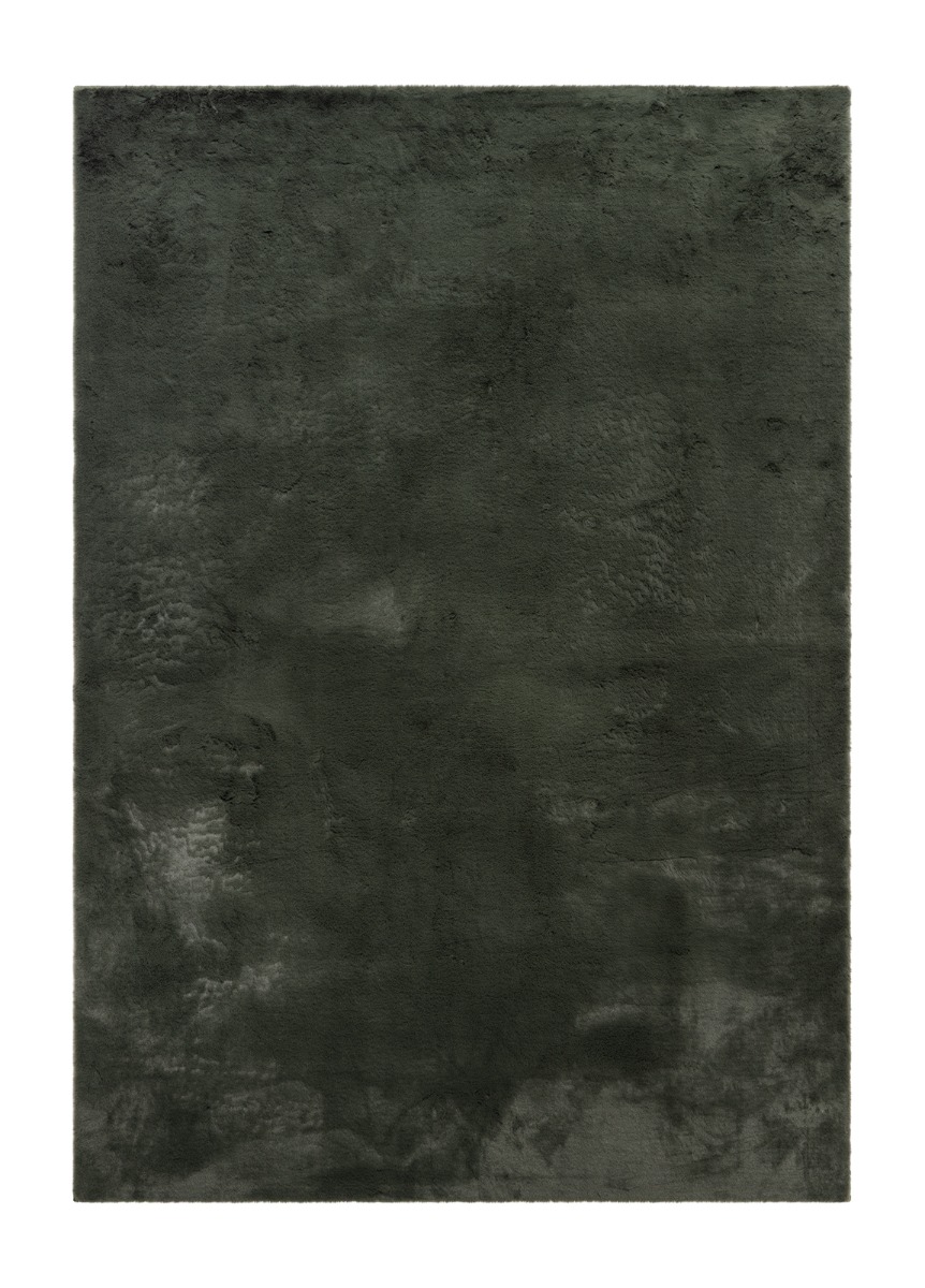 Grön mjuk päls-look matta med tjock struktur i ett mysigt rum