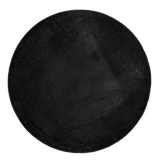 Rund svart mjuk pälsmatta med 25 mm tjock lugg i elegant rumsmiljö
