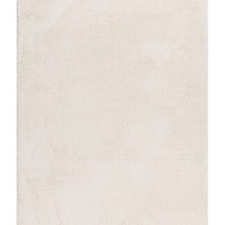 Cremefärgad mjuk ryamatta med tjock lugg som ger en varm och mysig känsla