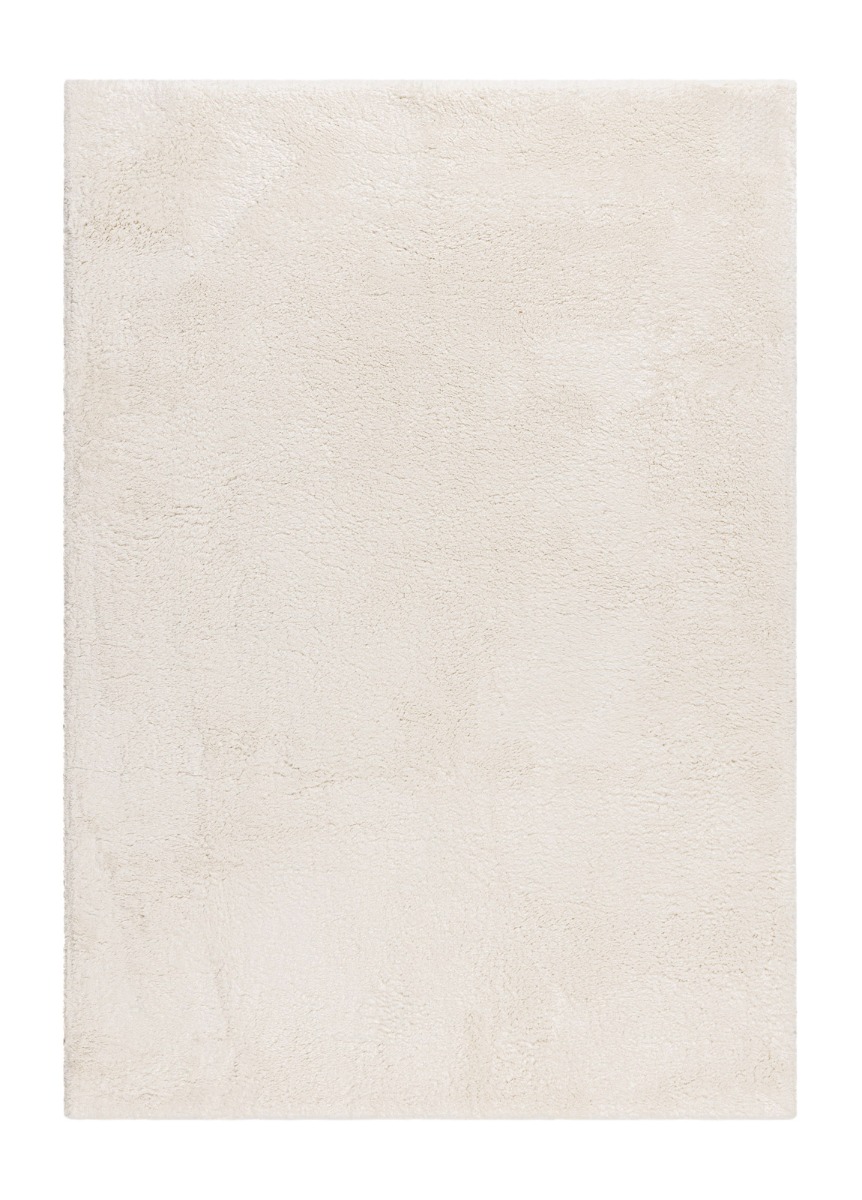 Cremefärgad mjuk ryamatta med tjock lugg som ger en varm och mysig känsla