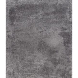 Grå mjuk ryamatta med tjock lugg på vardagsrumsgolv