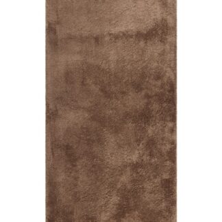 Lucid Mocca mjuk ryamatta med tät lugg i varm brun ton på trägolv