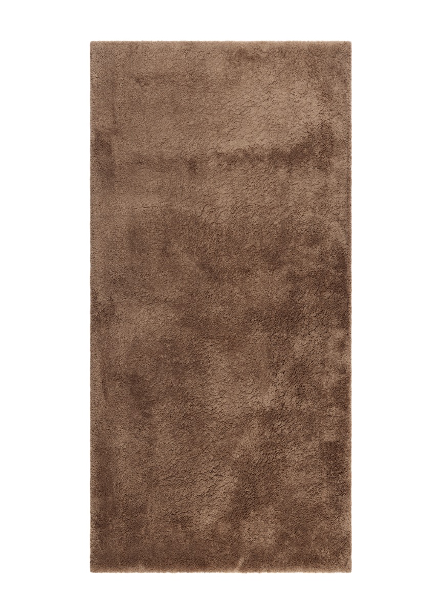 Lucid Mocca mjuk ryamatta med tät lugg i varm brun ton på trägolv