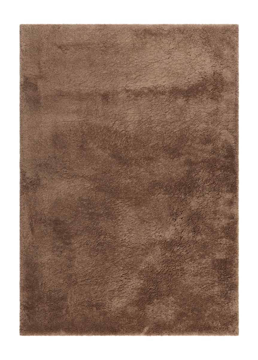 Mjuk mocca färgad ryamatta med tjock lugg på golv i vardagsrum