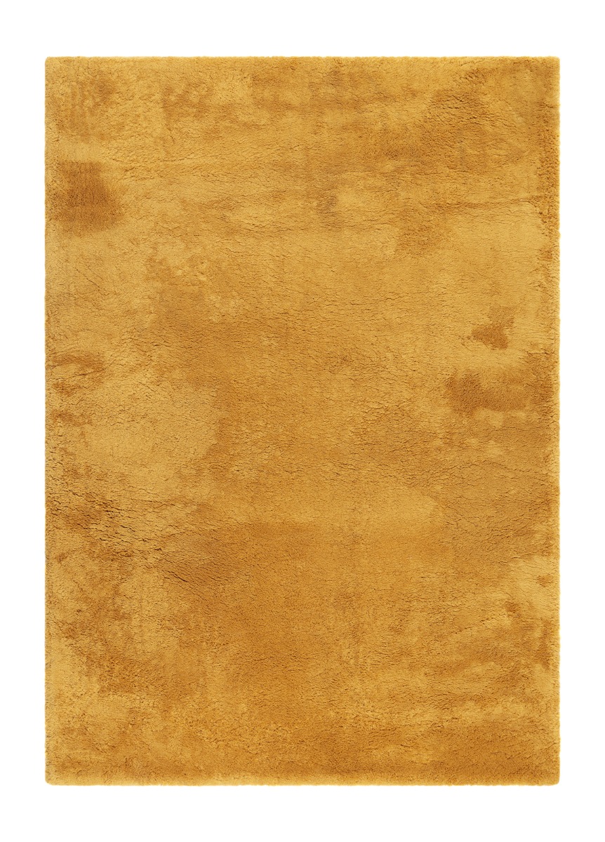 Tjock mjuk ockragul ryamatta med hög lugg i ett modernt vardagsrum