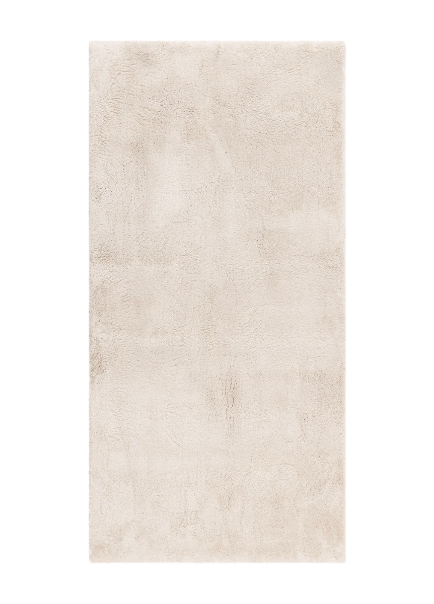 Naturfärgad mjuk ryamatta med tjock lugg i vardagsrumsmiljö