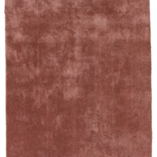 Glansfull rosa ryamatta i mjuk polyester med cirka 15 mm tjocklek i en hemtrevlig miljö