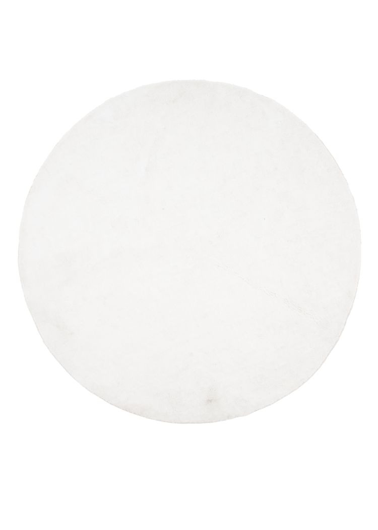 Vit rund ryamatta med mjuk och tjock polyesteryta placerad på golv
