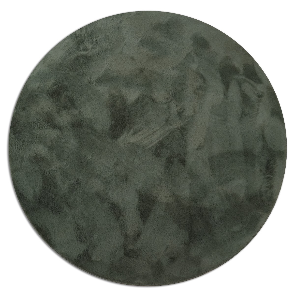 Rund grön matta i kortklippt polyester med mjuk yta i hemtrevlig miljö