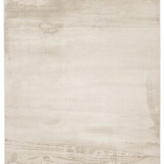 Beige mjuk tvättbar pälsmatta med tjock lugg och gummibaksida på golv