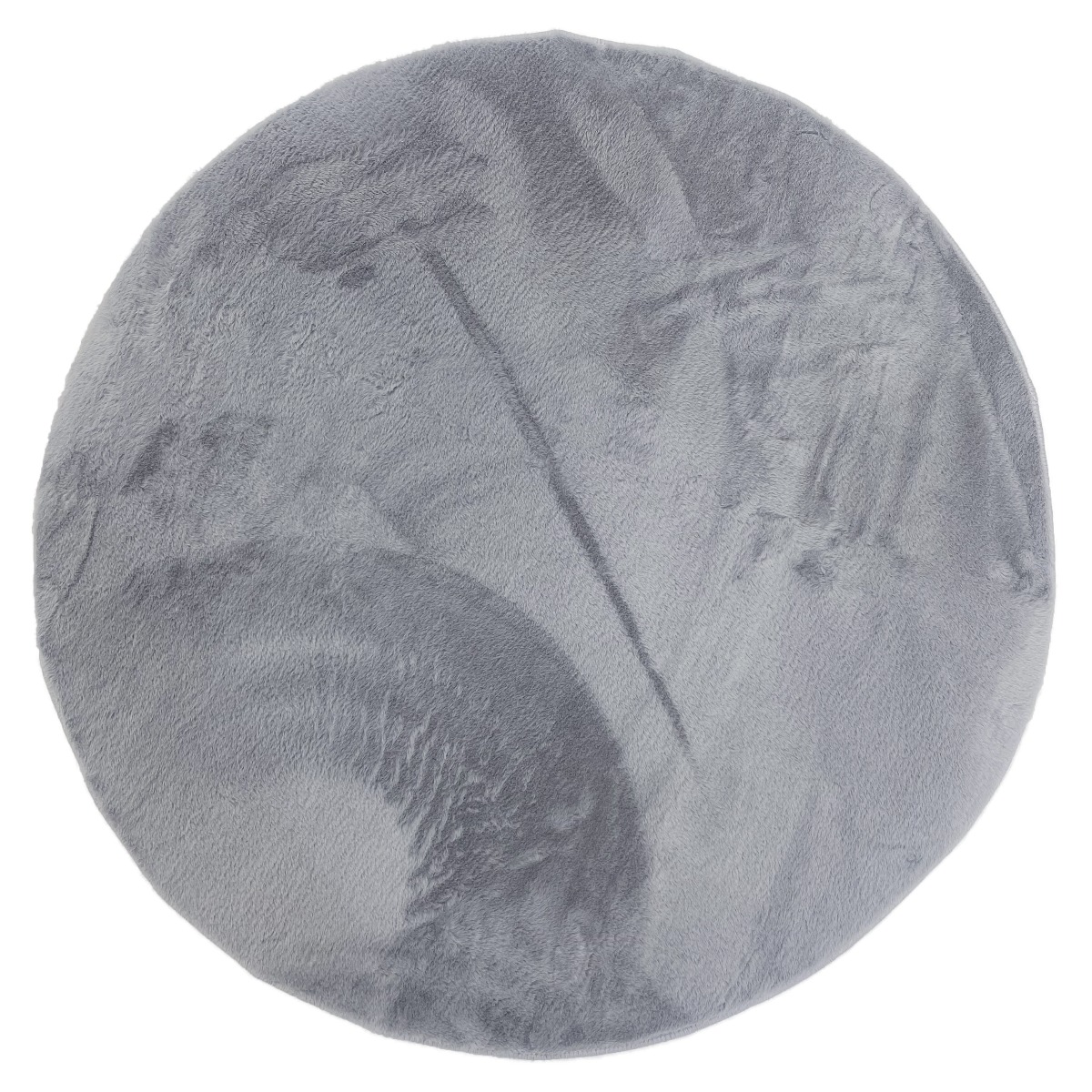 Rund silverfärgad pälsmatta i mjuk polyester med ca 15 mm tjocklek på trägolv