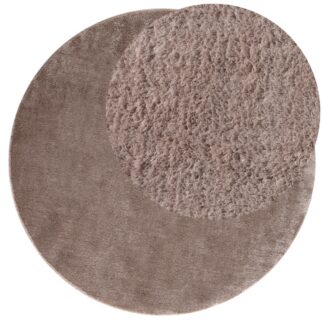Rund mjuk ryamatta i taupe färg med ca 20 mm tjocklek i heminredning