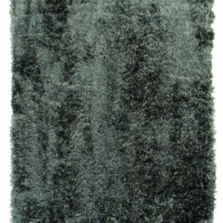 Grön mjuk ryamatta med lång lugg i ett ljust vardagsrum