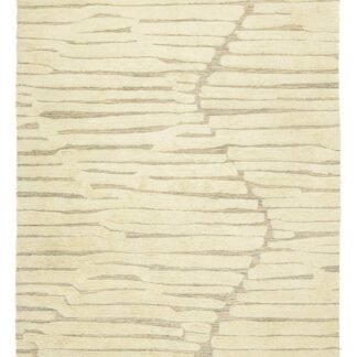 Beige ullmatta med mjuk tjock textur i naturlig ull på golv