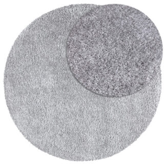 Rund grå ryamatta i mjuk polypropylen med cirka 30 mm tjocklek i modernt rum