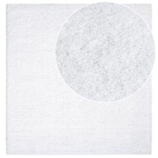 Vit tjock och mjuk ryamatta i polypropylen med fluffig textur i vardagsrumsmiljö