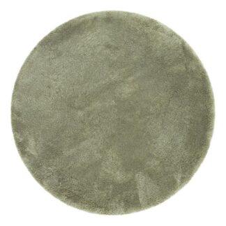 Grön rund ryamatta med tjock och mjuk lugg i vardagsrumsmiljö