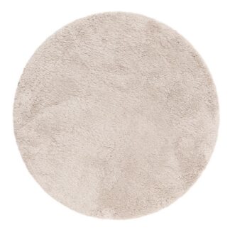 Rund ryamatta i greige färg med tjock och mjuk lugg på trägolv