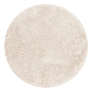 Rund mjuk ryamatta i naturfärgat med tjock lugg på golv i modernt vardagsrum