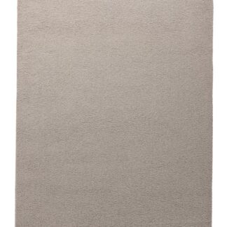 Beige Miren ryamatta i mjuk polyester med tjock textur placerad i vardagsrum