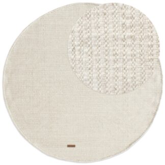 Rund ullmatta i offwhite med mjuk och tjock struktur på golvet