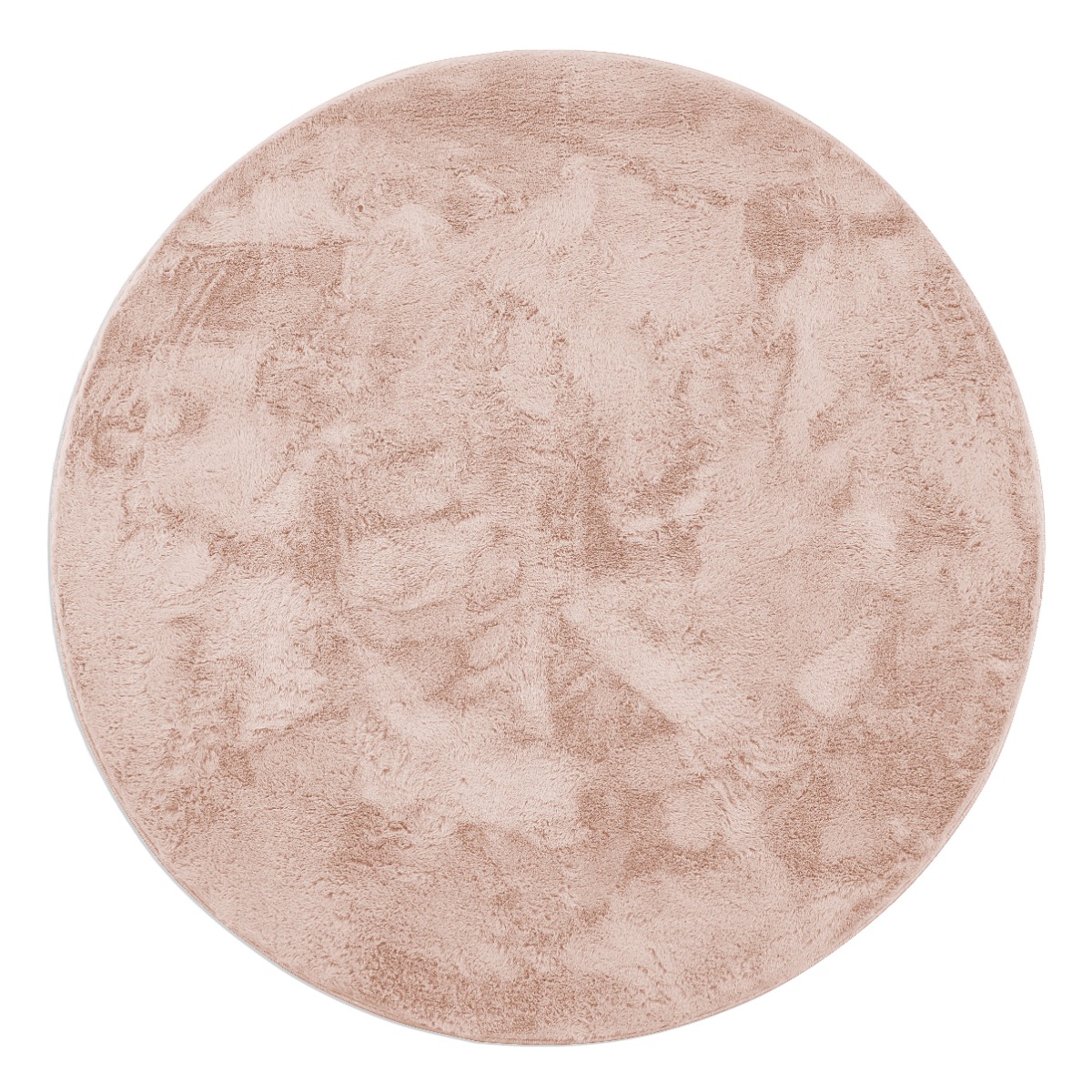 Rund fluffig rosa pälsmatta i tjock polyester på trägolv i modernt rum