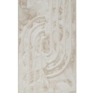 Ljusbeige och fluffig Rabbit Soho pälsmatta med lång lugg i hemtrevlig miljö