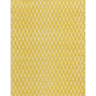 Handvävd gul plastmatta Mimmi Sian med spegelvänd baksida liggande på golv