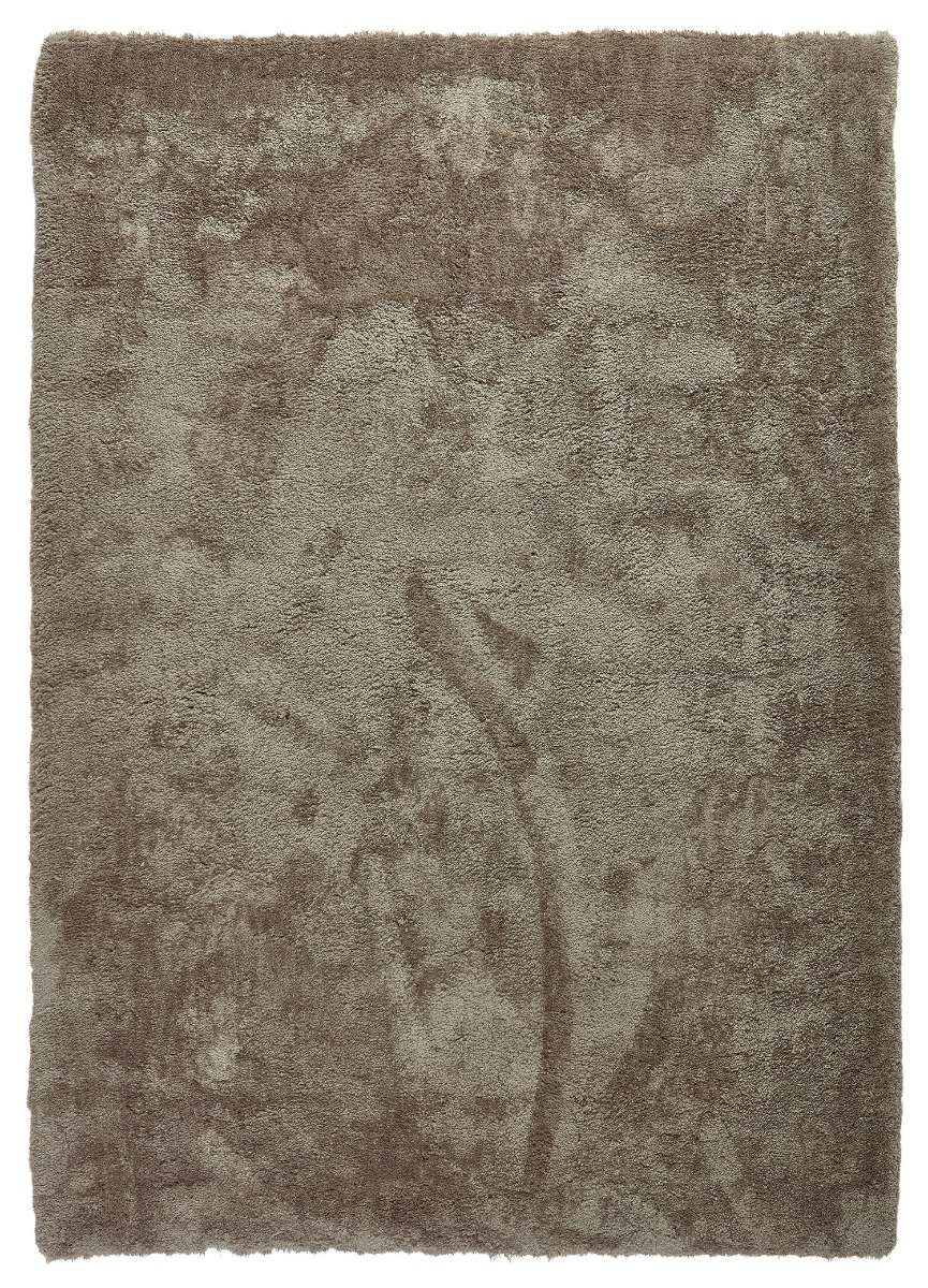 Mullvad ryamatta i mjuk brungrå ton med tät lugg i ett hemtrevligt vardagsrum