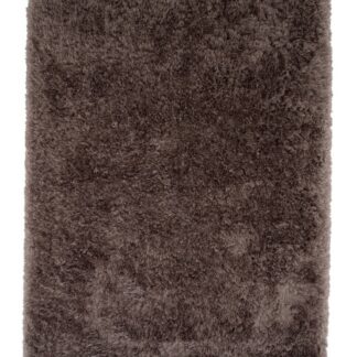 Valby ryamatta i varm brun färg med mjuk och tjock textur i ett modernt vardagsrum