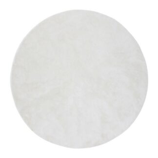 Rund vit ryamatta i tjock mjuk polyester på golv med ljus inredning