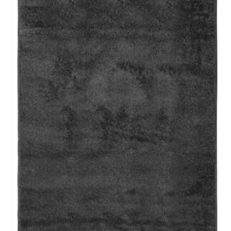 Svart mjuk plysch ryamatta med nubby struktur och djup lutning i elegant design