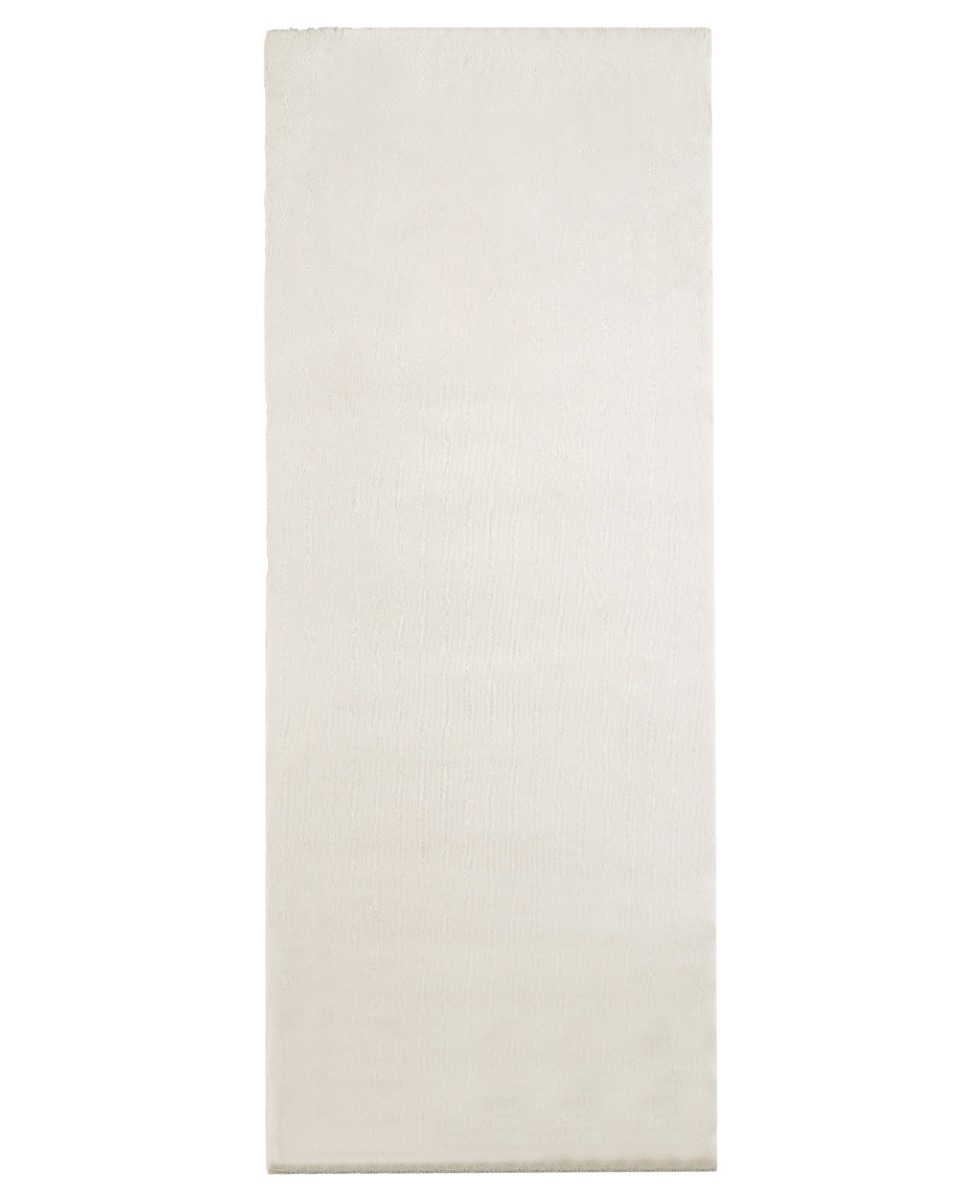 Offwhite mjuk konstpälsmatta med fluffig yta i elegant hemmiljö