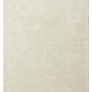 Offwhite ullmatta Vallbo med mjuk textur och cirka 13 mm tjocklek placerad i ett modernt rum