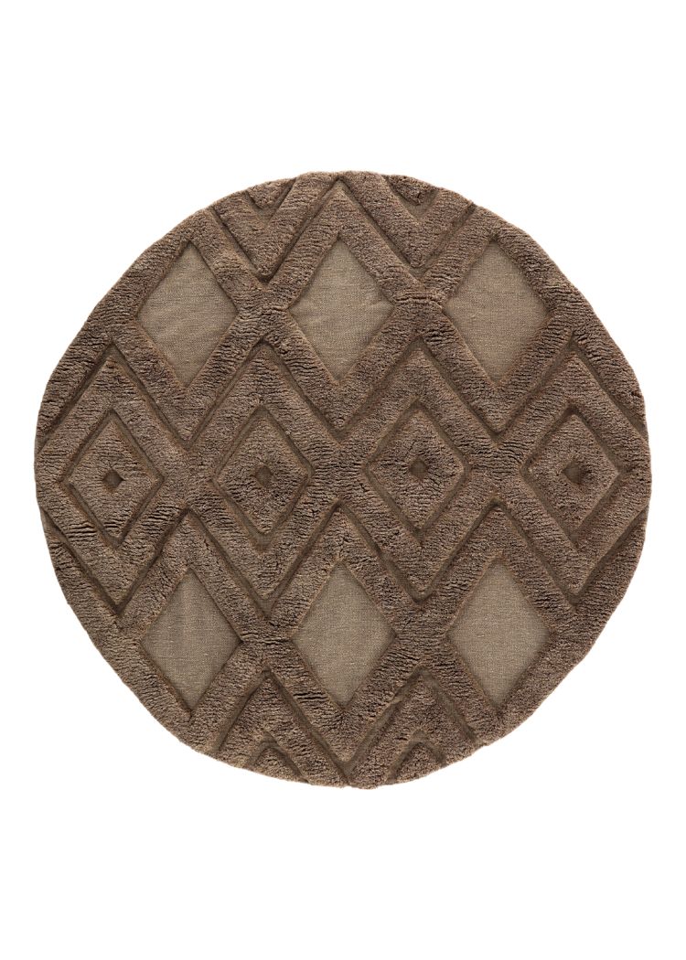 Rund brun ullmatta med mjuk textur och tjocklek cirka 15 millimeter