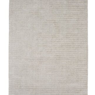 Ljusgrå ullmatta med cirka 15 mm tjocklek placerad i modernt rum