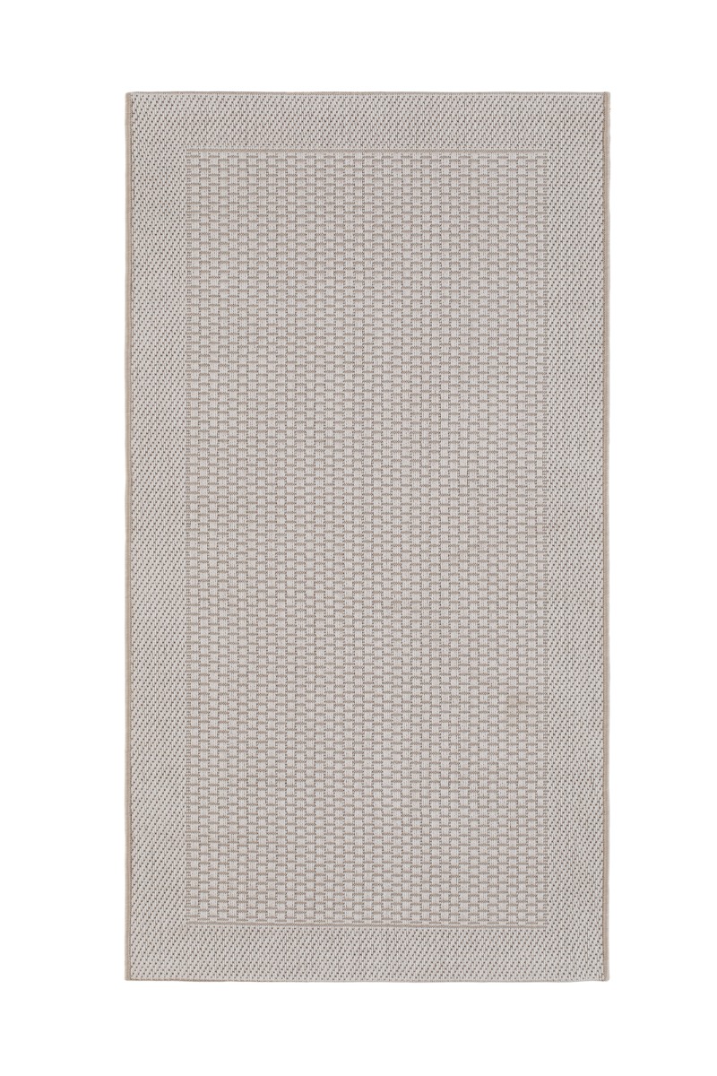 Vit slätvävd gångmatta av polypropylen med hållbar och halksäker undersida för inomhus och utomhusbruk