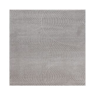 Grå Santos matta i polypropylen med subtilt mönster och varierande vävtextur, placerad i modernt rum för inomhus- och utomhusbruk