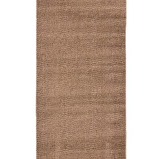 Beige Kura ryamatta i mjuk polyester med strukturerad yta och tjocklek cirka 11 mm placerad på golv