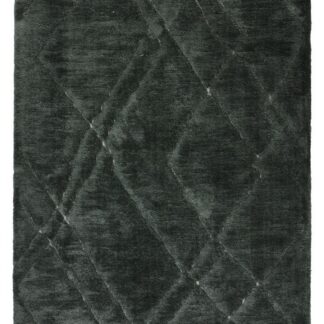 Tjock och mjuk grön ryamatta med subtila reliefmönster på golvet i ett modernt rum